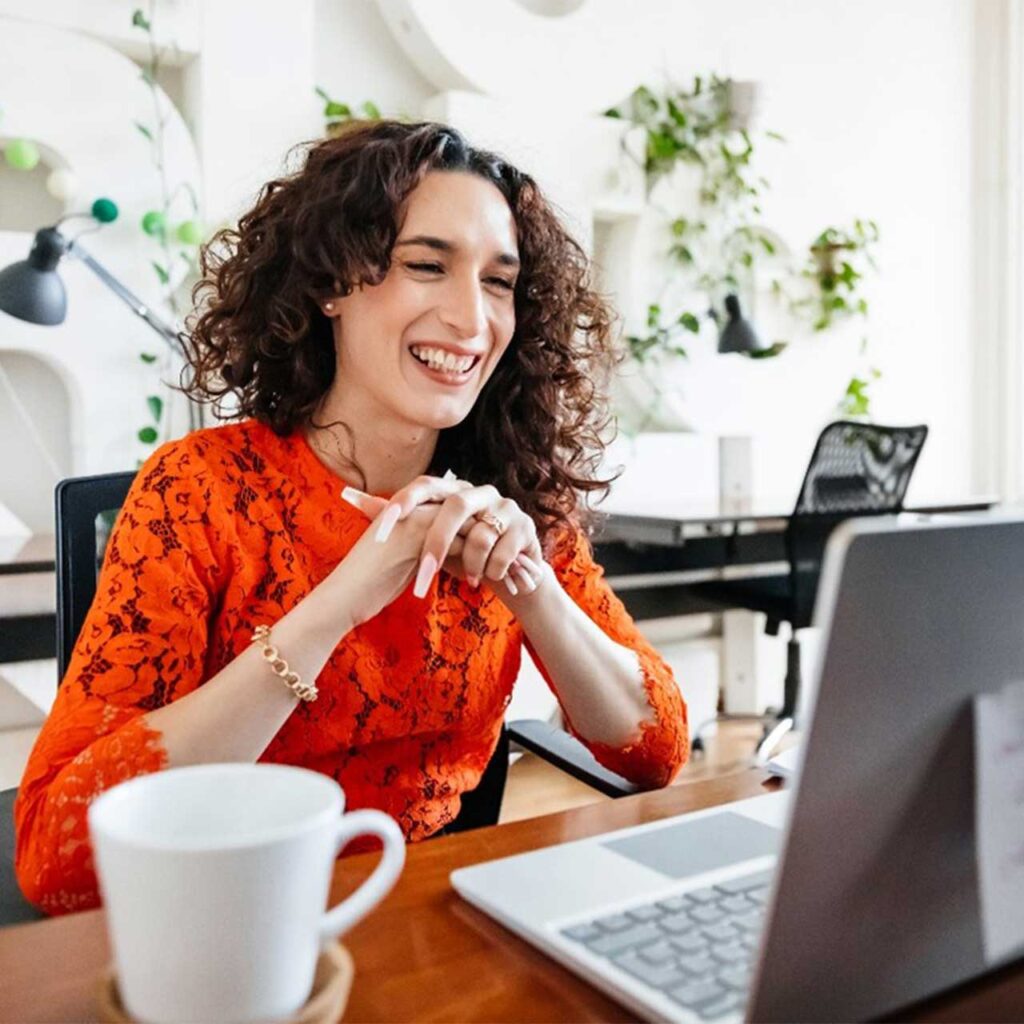 Woman smiling at laptop