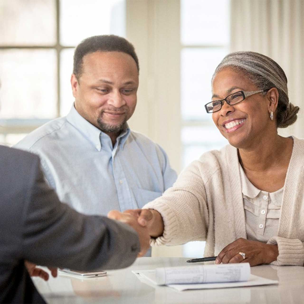 Shaking hands with business owner